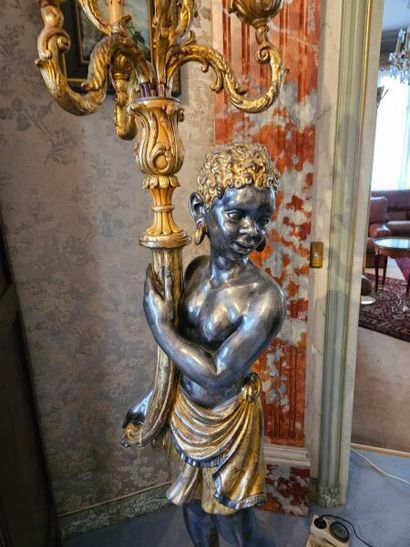 Gilded patinated wood group presenting a...