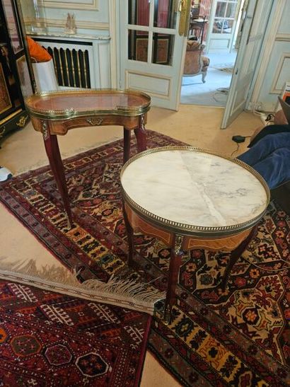 Two lounge tables; one kidney-shaped, the...