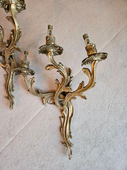 Pair of ormolu three-light sconces in rocaille...