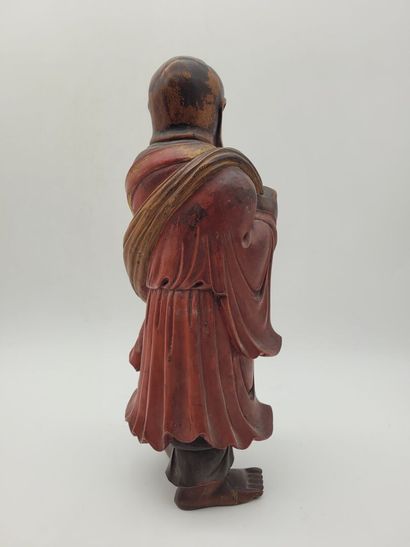 CHINA
Wooden sculpture of Lohan, wearing...