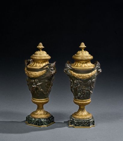 Pair of Louis XVI style covered pots in bronze...