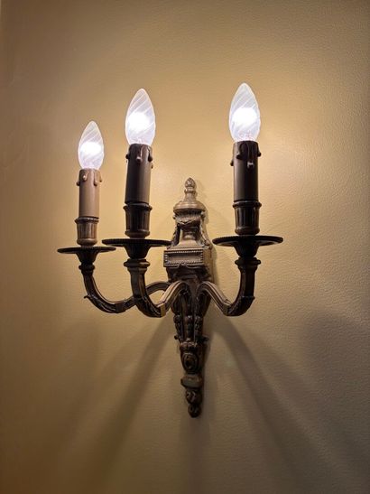 Pair of three-light ormolu sconces topped...