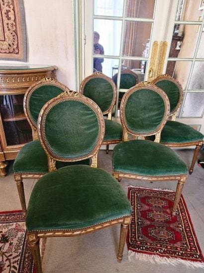 Suite of five carved giltwood chairs with...