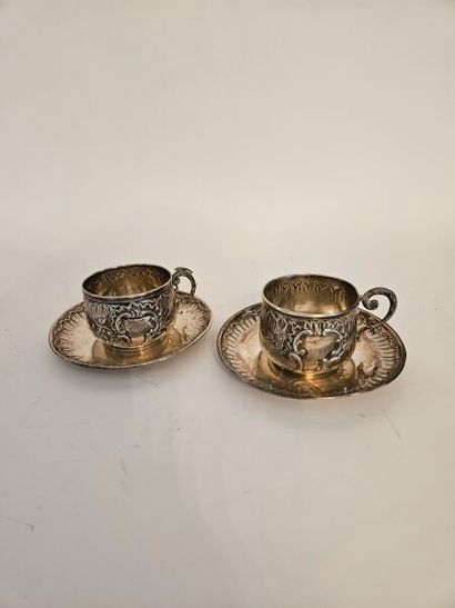Two silver cups and two silver saucers with...