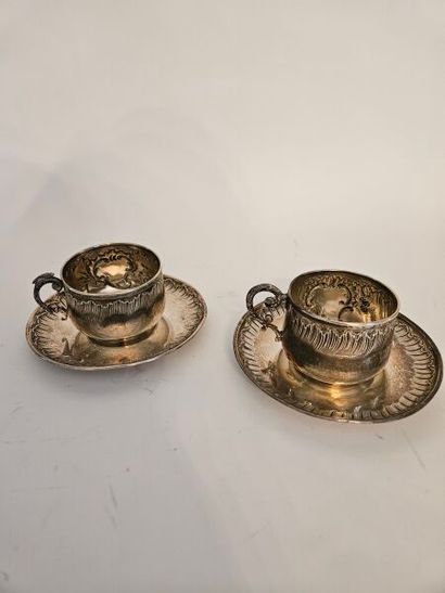Two silver cups and two silver saucers with...