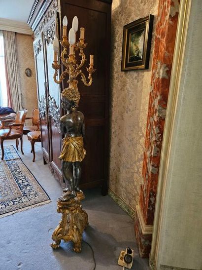 Gilded patinated wood group presenting a...