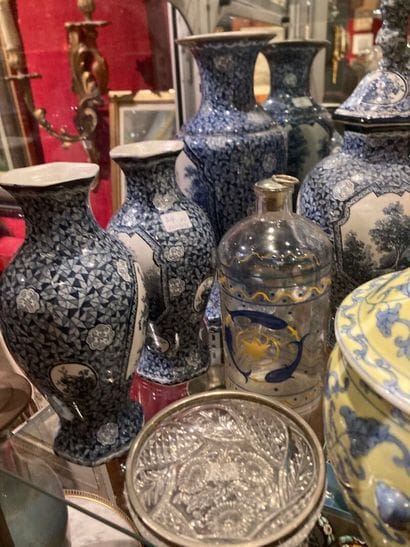 Lot including:
Set of four vases and one...