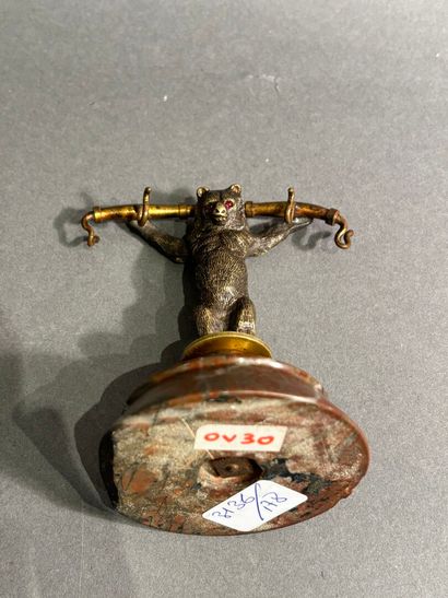 Bronze watch-holder featuring a bear on a...
