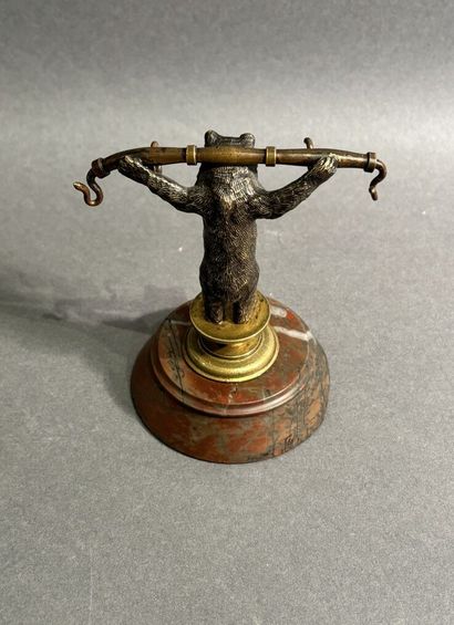 Bronze watch-holder featuring a bear on a...