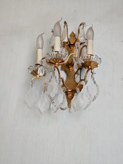 A pair of 3-light ormolu sconces with crystal...