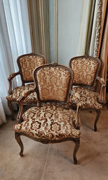 Three cabriolet armchairs in natural wood...