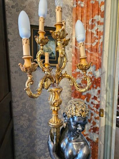 Gilded patinated wood group presenting a...