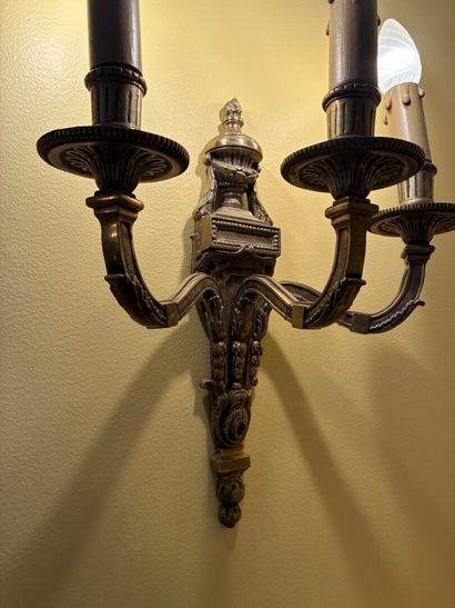 Pair of three-light ormolu sconces topped...
