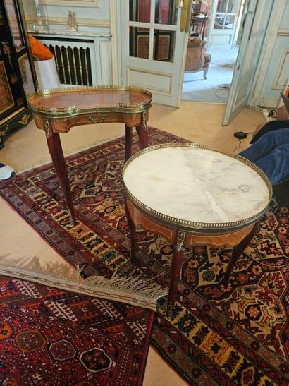 Two lounge tables; one kidney-shaped, the...