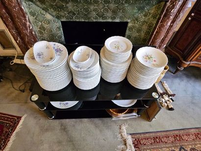 Two sets of white porcelain dinner services...