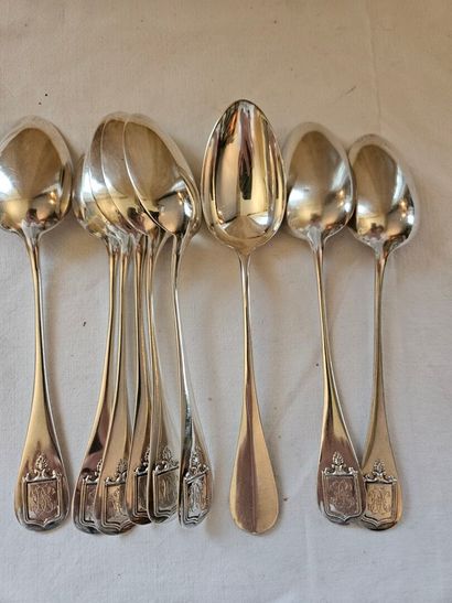 Nine silver dessert spoons spatula decorated...