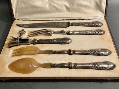 Set including a carving set, a leg of lamb...