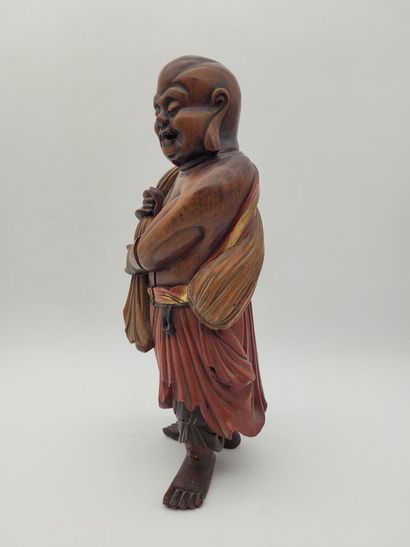 CHINA
Wooden sculpture of Lohan, wearing...