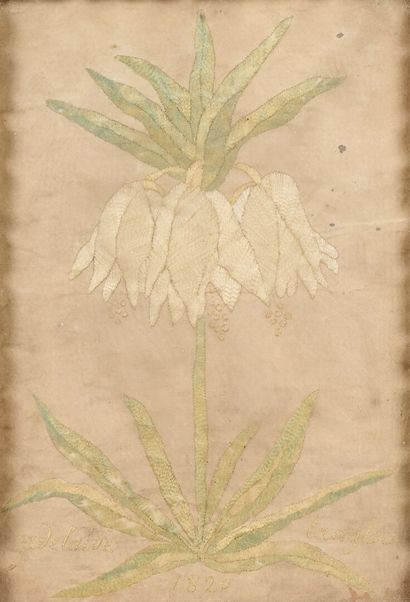 Embroidered flower on fabric marked 