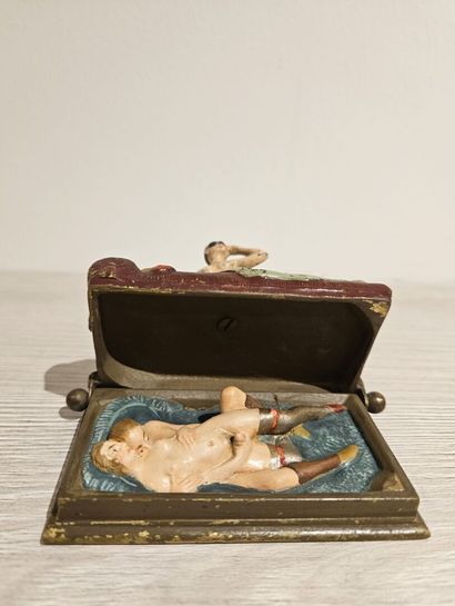 Bronze depicting a woman on a bed with a...