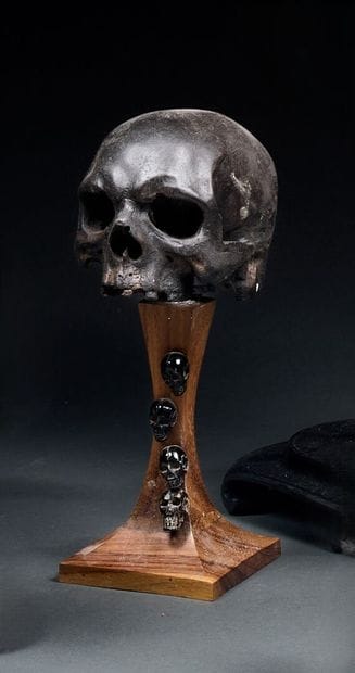 Memento mori on antique wooden stand decorated...