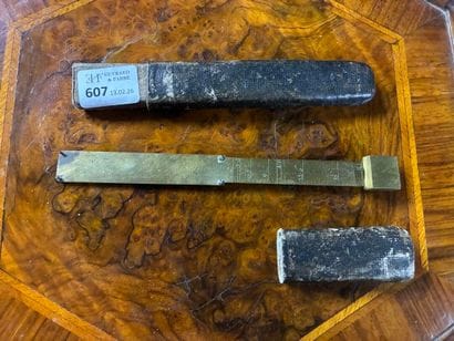Brass ruler in leather case marked 
