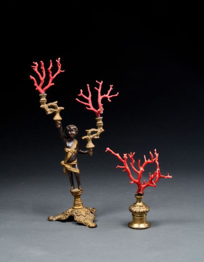 Cherub bearing two branches of red coral
Corallium...