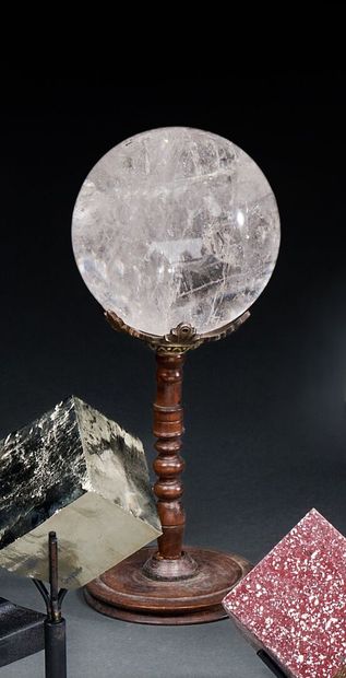 Genuine rock crystal ball on antique pedestal
H....