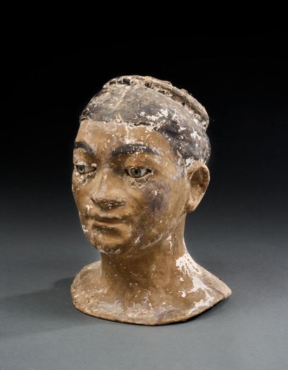 Papier-mâché woman's head with sulfide eyes
Probably...