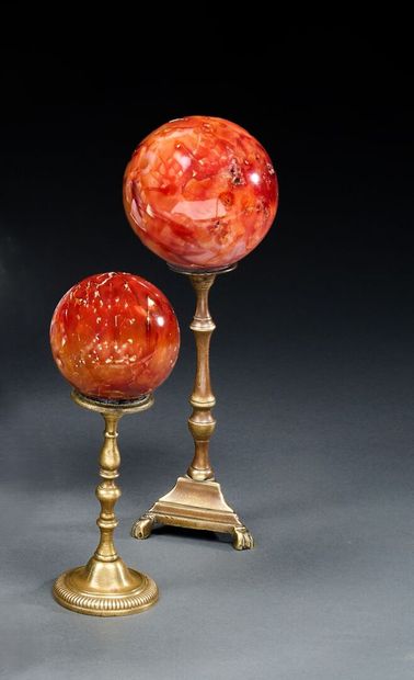 Pair of carnelian balls on antique brass...
