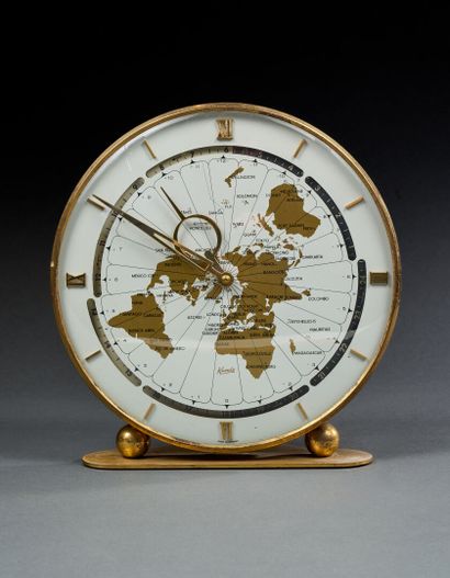 KUNDO
Brass desk clock with planetary wheel
Bears...