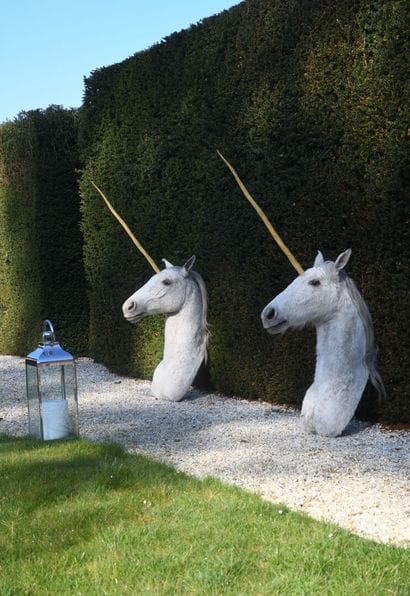 Pair of horse heads mounted with a resin...