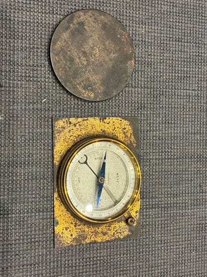Brass compass marked 