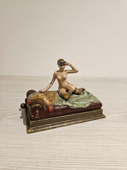 Bronze depicting a woman on a bed with a...