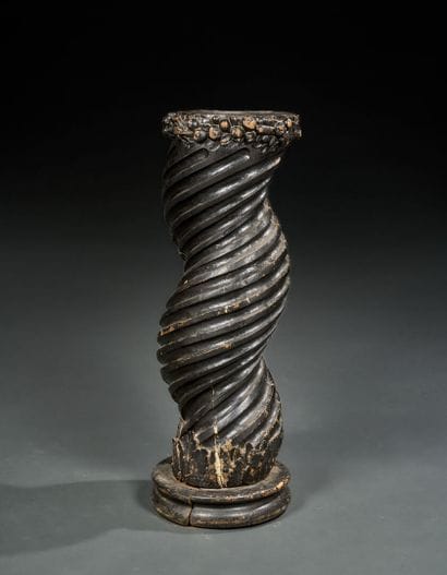 Torso column in carved and stained wood 
The...