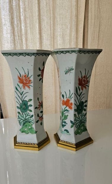 Pair of white-ground porcelain conical vases...