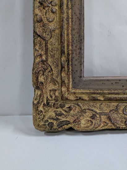 Set of two wooden and stucco frames decorated...