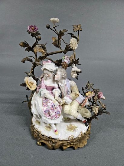 Romantic Scene
Porcelain group set in a gilded...