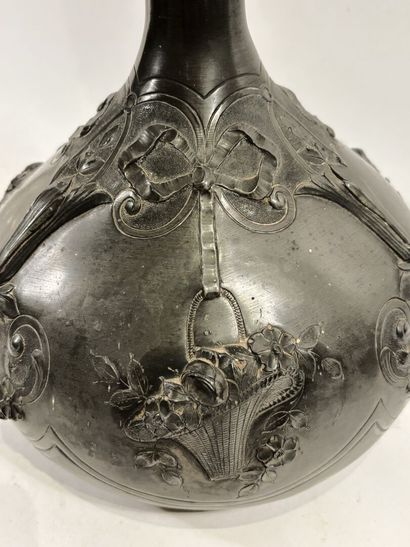 Long-necked pewter ball vase with repoussé...