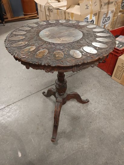 Carved natural wood side table with a painted...