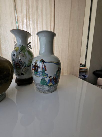 Set of three oval porcelain vases decorated...