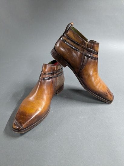 BERLUTI
Pair of men's high-top leather shoes,...