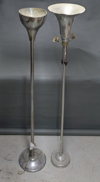 Two metal reflectors, one of which is chrome-plated...