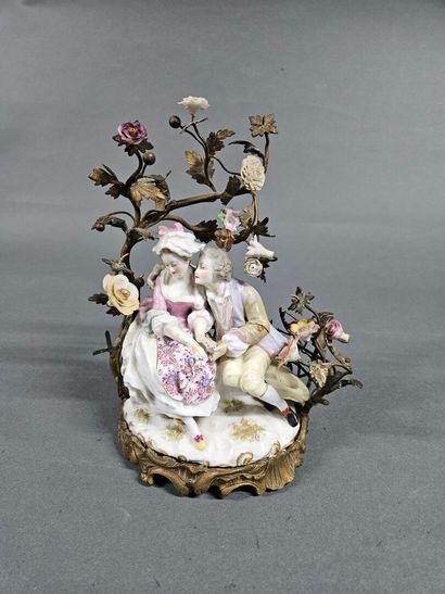 Romantic Scene
Porcelain group set in a gilded...