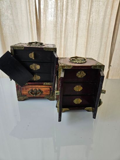 CHINA
Two small wooden cabinets, each with...