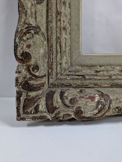 Carved wooden frame with Bérain decoration...