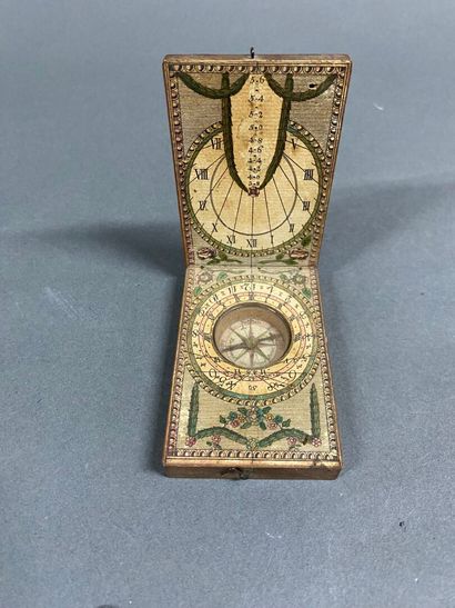Trebuchet in its box, sundial, and folding...