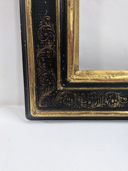 Set of two lacquered wooden frames with gold-trimmed...