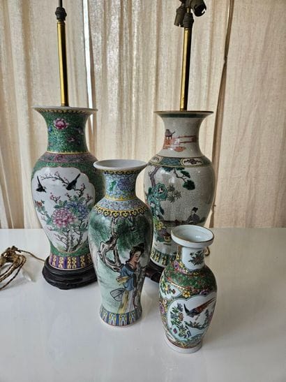 CHINA
Two green-glazed porcelain vases mounted...