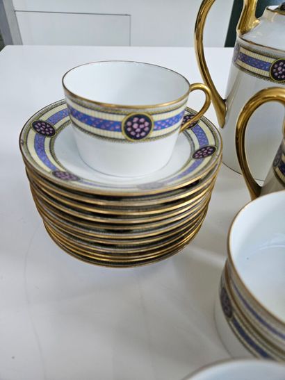 A white and gold porcelain coffee set decorated...